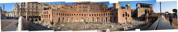 Part of the Imperial Fora—at the left edge, you can see Trajan’s Column. In the distance along the railing at right, you can faintly see the Basilica of Maxentius and Constantine across the Via dei Fori Imperiali in the Roman Forum.